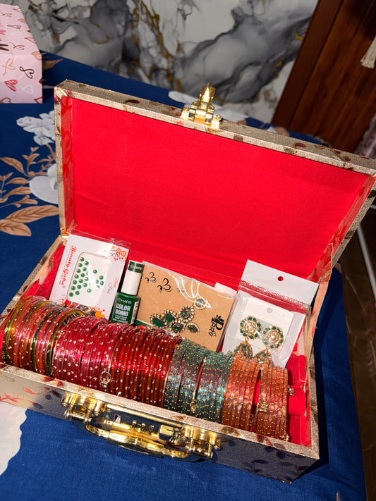 Sawan Special Premium Hamper (60 Diamond Bangles + 12 Kashmiri Ghungroo Bangles + Bindi + Mehndi + Nail Paint + 2 Jhumka +
Sindur + Heavy Bangle Box )